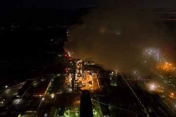 Aerial view of oil refinery. Industrial view at oil refinery plants with lots of light at night. 