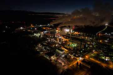 Aerial view of oil refinery. Industrial view at oil refinery plants with lots of light at night. 