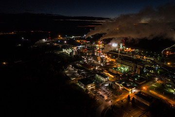 Aerial view of oil refinery. Industrial view at oil refinery plants with lots of light at night. 