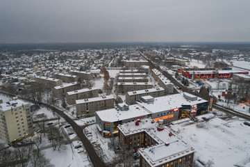 Obraz premium Aerial view of the city covered with snow.