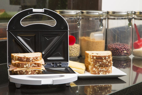 Open Sandwich Toaster with ingredients in a kitchen setting