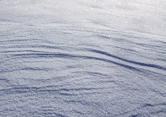 Fresh snow surface in sunny winter day.