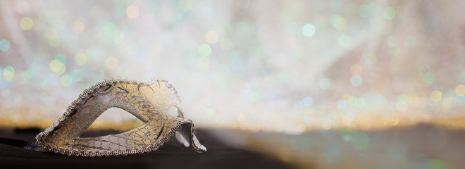 Silver carnival mask on bokeh background © Rawf8