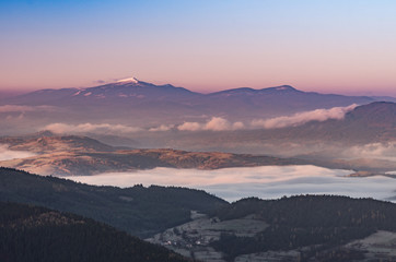Misty mountain landscape in the morning with Babia Gora mountain, Poland