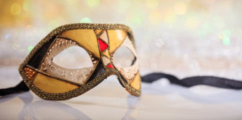 Handmade carnival mask on bokeh background