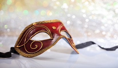 Handmade carnival mask on bokeh background