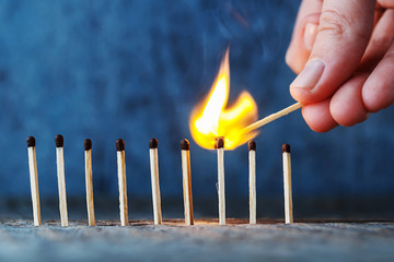 lit match fires another match