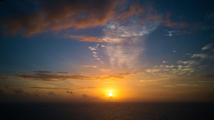 Naklejka na ściany i meble Beautiful sunset over ocean aerial shot