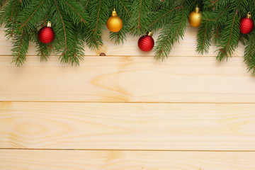 Christmas background. Top view with copy space. fir tree with cone on light wooden background