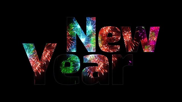 beautiful multi colored fireworks glow through the text Happy New Year. Composition for the new year celebration. Bright fireworks, amazing light show. V12