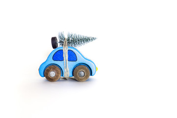 Christmas is coming! Holiday concept with a small pine tree on toy car