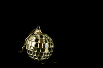 christmas ball of mirrors on black background with space to insert text