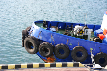 Tyre fender on tugbooat