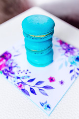 Cake macaron or macaroon on white background from above with blu