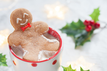 Hot white chocolate with funny gingerbread man