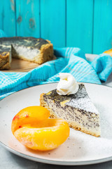 Pieces of delicious poppy seed cheesecake and peach