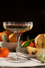 Winter holidays celebration with champagne and panettone traditional sweet italian dessert