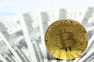 Bitcoin golden coin New virtual money and dollar background . Cryptocurrency. Business and Trading concept. Close-up shot