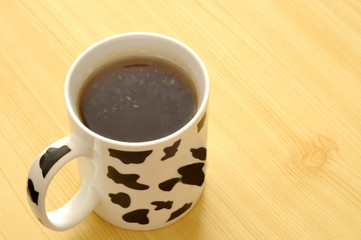 spotted cup with green tea