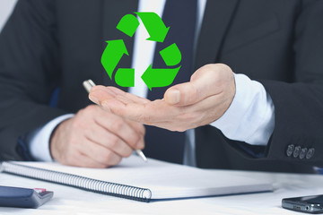 businessman with the symbol of recycling