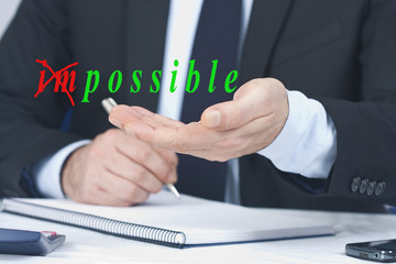 man business hand with the concept of impossible
