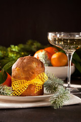 Winter holidays celebration with champagne and panettone traditional sweet italian dessert