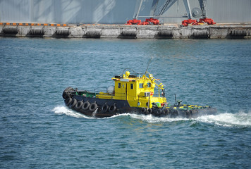 Tugboat in harbor quayside