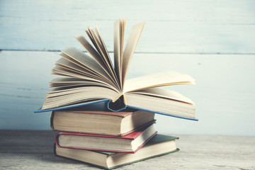 old book open on a wooden table