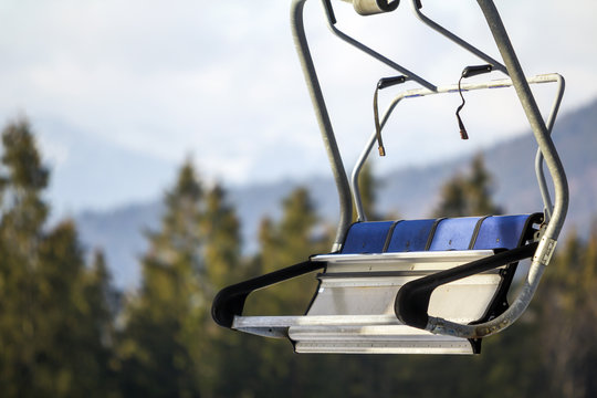 Empty Chair Lift Bench In Mountains