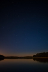 Fototapeta na wymiar Scenic view of lake against star field at night