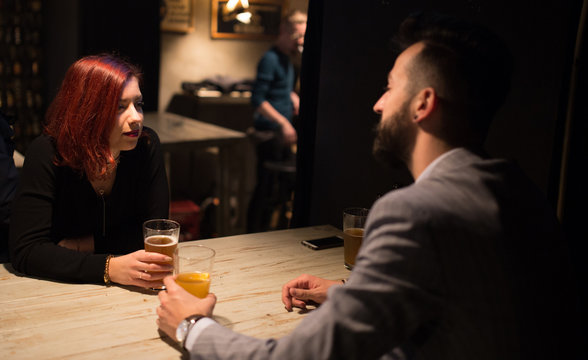 Couple in a pub, talking