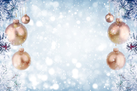 Christmas background with golden ornaments and falling snow 