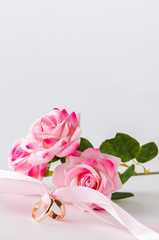 Wedding concept with rings and roses