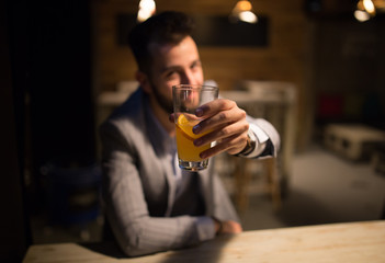 Man in a pub, toast with craft beer