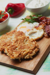 Hash browns with egg and bacon