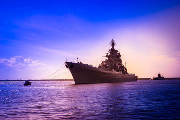 A warship sails to the sea. Naval forces. Military convoy.