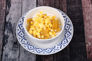 Delicious streamed sweet corn ,pumpkin and ,ginkgo in coconut milk .