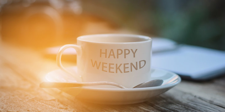 Happy Weekend coffee cup at office background or student workplace. E-learning, self-education concept
