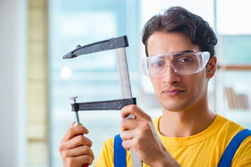 Furniture carpenter working in the workshop