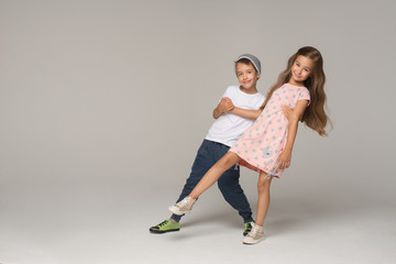Happy dancing kids. Studio photo.