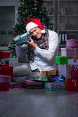 Man with many christmas gifts in boxes