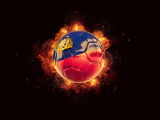 Fototapeta premium Football in flames with flag of liechtenstein