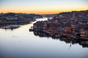 Top view of Douro river and Ribeira promenade at dusk. Porto, Portugal.