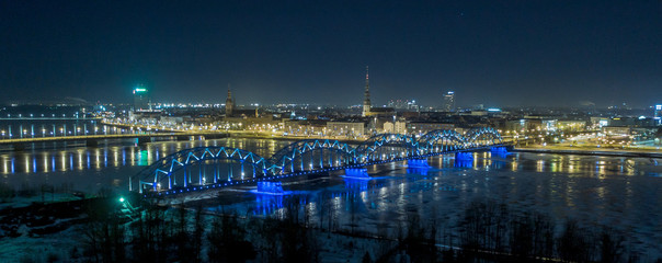 Fototapeta na wymiar Riga city bridge And Old Town Autumn Drone flight trafics and cars above night