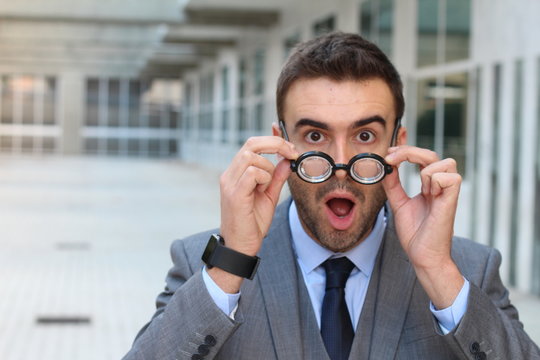 Surprised man with glasses close up