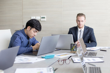 Business people working at meeting room together.