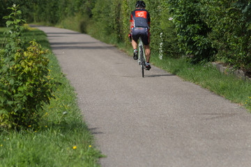 outdoor running or cycling in sunny summer © rudolfgeiger