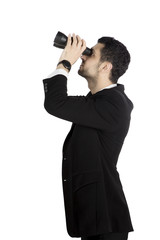Young manager seeing through binoculars