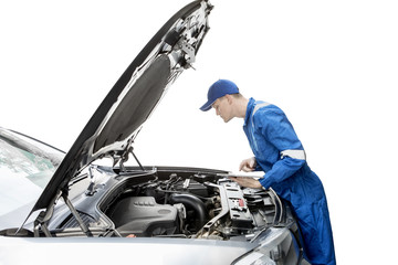 American mechanic checking car with tablet