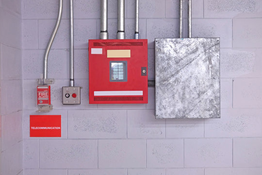 fire alarm switch on wall. Electrical Conduit & PVC Conduit